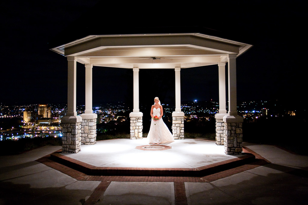 Photograph of a bride in gazebo in front of Drees Pavilion in Devou Park