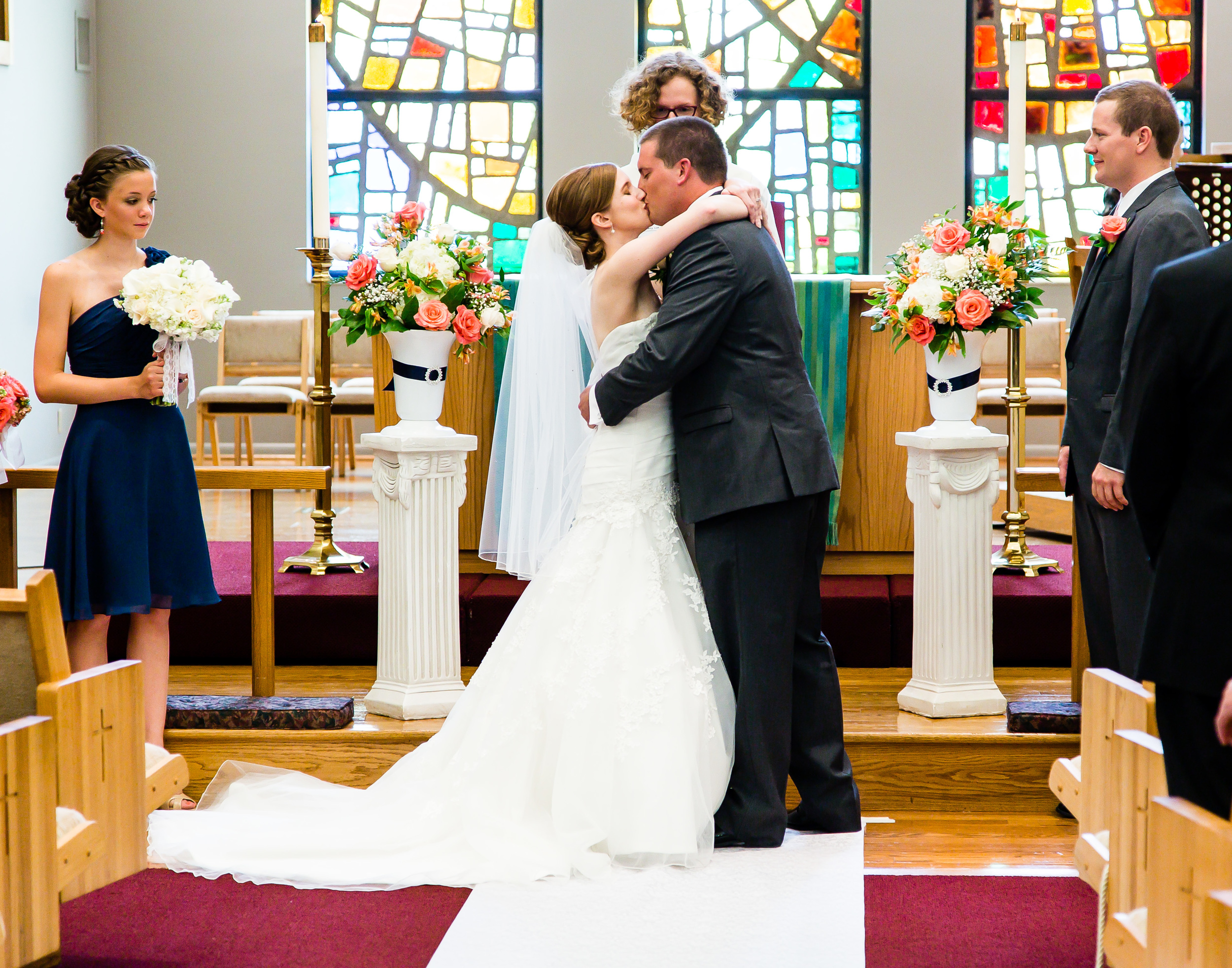 Photograph of bride and groom first kiss