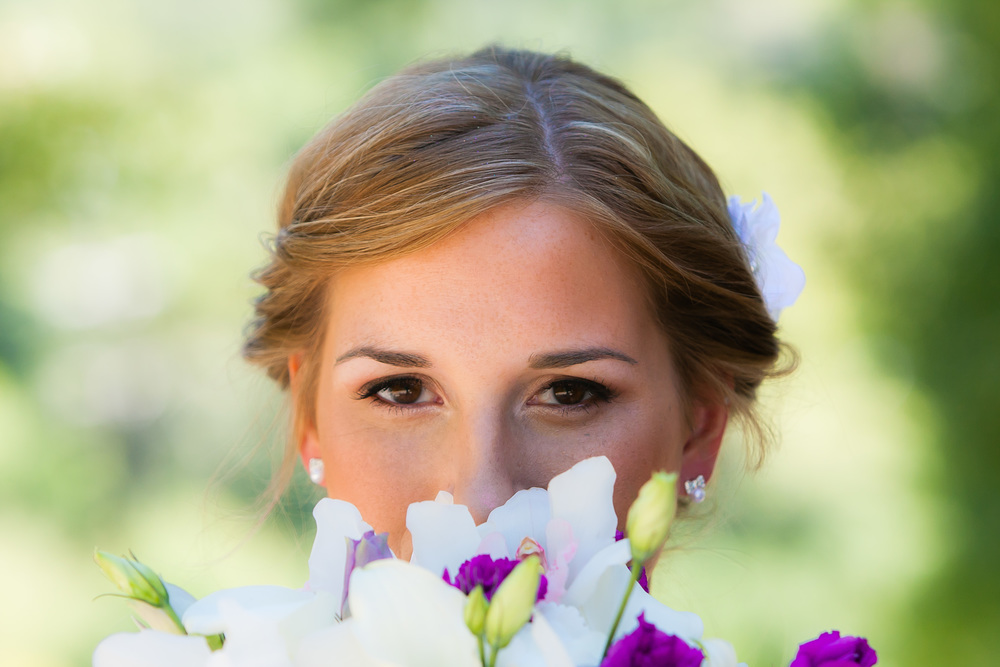 Photograph of a bride with wedding flowers